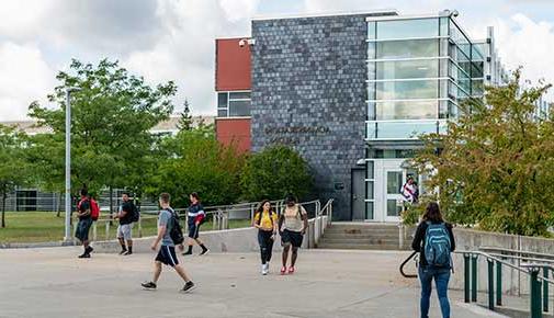 Students walking around outside on campus